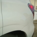 Before and after photographs of a damaged white Subaru that was repaired by Elite Paint & Body Shop in West Palm Beach, Florida